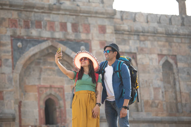 istock Couple taking selfie at historic site during holiday 1477120083