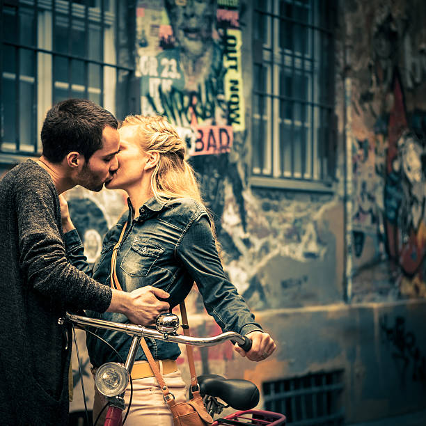 Young Love in Berlin Young German lovers kissing in Berlin, Germany. kissing on the mouth stock pictures, royalty-free photos & images