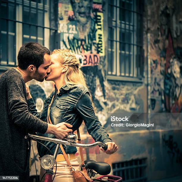 Young Love In Berlin Stock Photo - Download Image Now - Kissing, Berlin, Graffiti