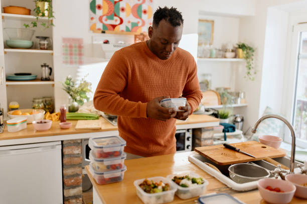 istock Man preparing healthy balanced vegetarian food 1477123010