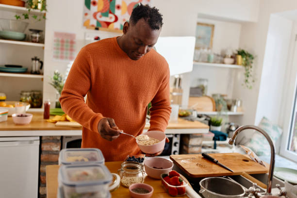 istock Man preparing healthy balanced vegetarian food 1477123015