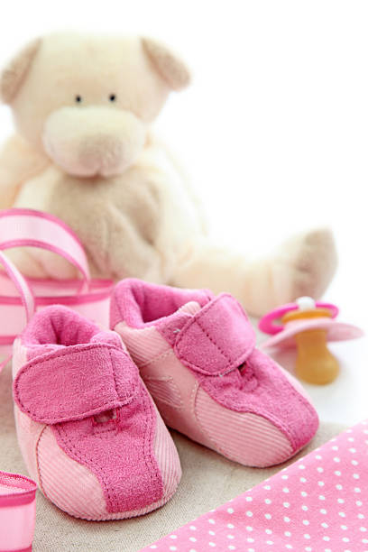 istock Pink baby shoes 147712343