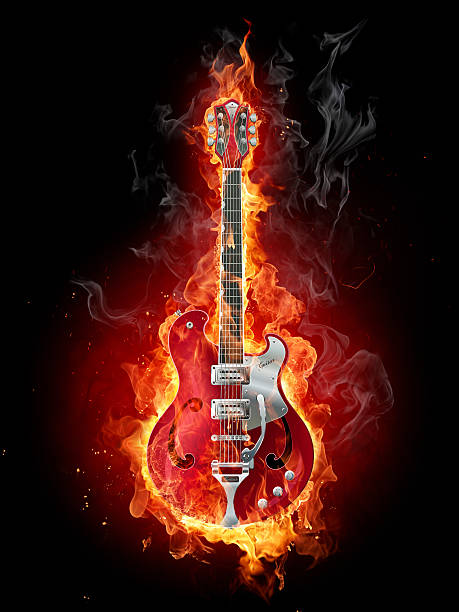 Guitar on fire with black background  stock photo
