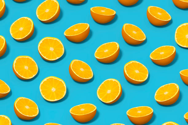istock Orange Slices with Sunlight on Blue Background 1477134649