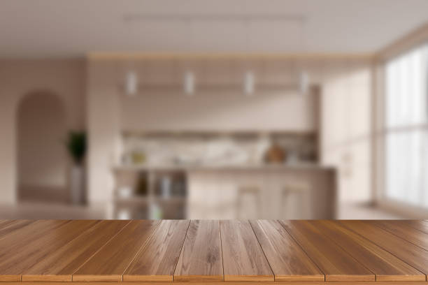 istock Wooden island on blurred background of light kitchen interior. Mockup 1477135316