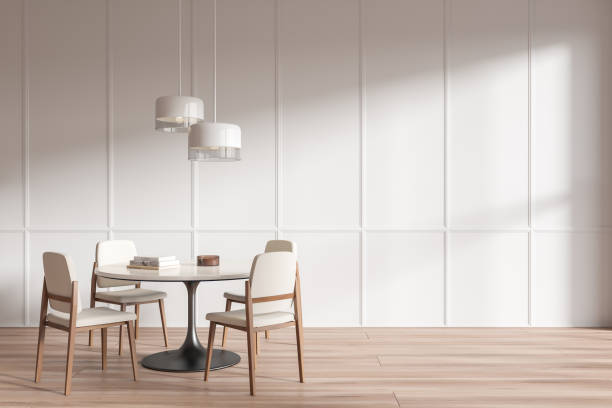 istock Stylish living room interior with eating table and seats, empty molding wall 1477136183