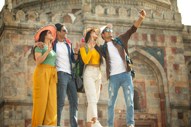 istock Group of friends taking selfie at historic site 1477136520