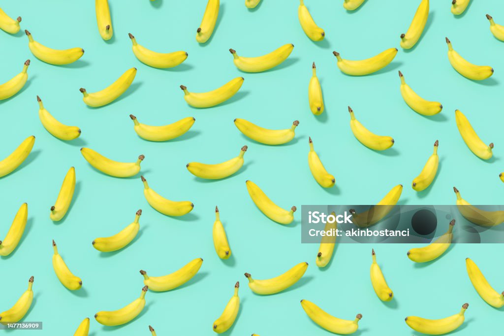 Banana with Sunlight on Blue Color Background Banana with Sunlight on Blue Color Background, 3d render. Banana Stock Photo