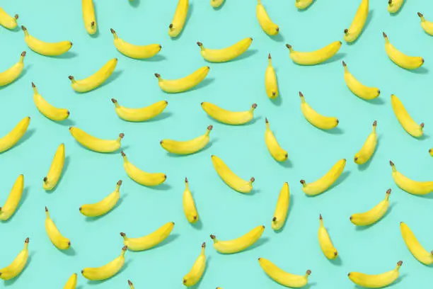 Photo of Banana with Sunlight on Blue Color Background