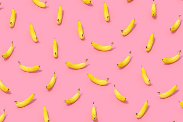 istock Banana with Sunlight on Pink Color Background 1477136946