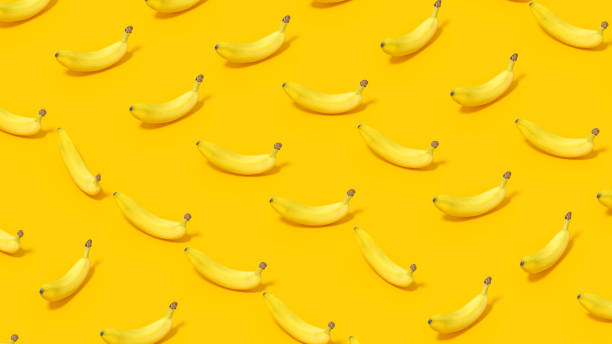 istock Banana with Sunlight on Yellow Color Background 1477136977