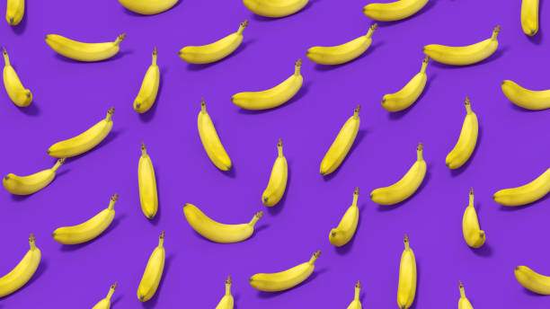 istock Banana with Sunlight on Purple Color Background 1477137072