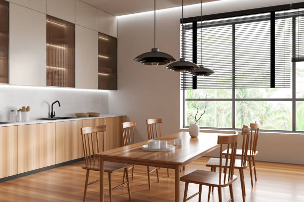 istock Stylish kitchen interior with cooking and eating corner near panoramic window 1477138535
