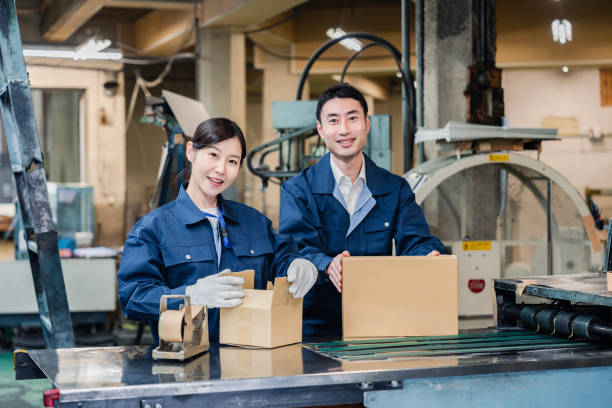 Staff working on shipping packages stock photo