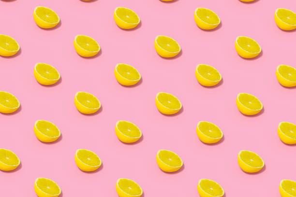 Yellow Lime Slices with Sunlight on Pink Background, 3d render.