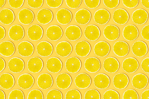 Yellow Lime Slices with Sunlight on Yellow Background, 3d render.