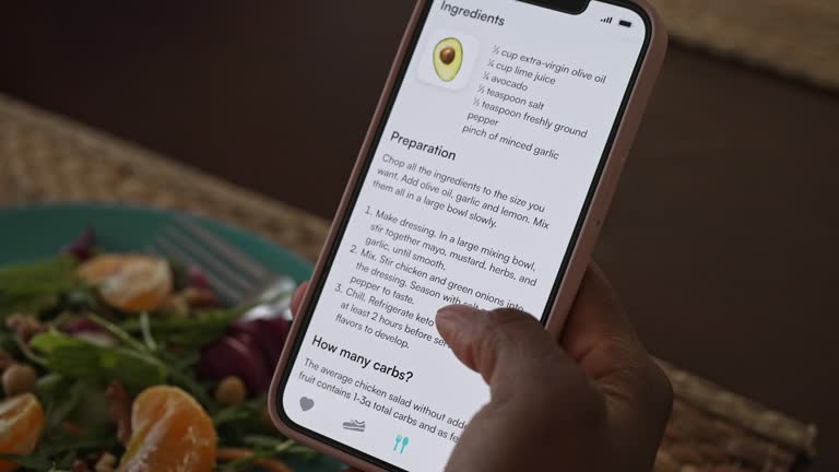 Woman checking nutrition information and calories on her phone when eating