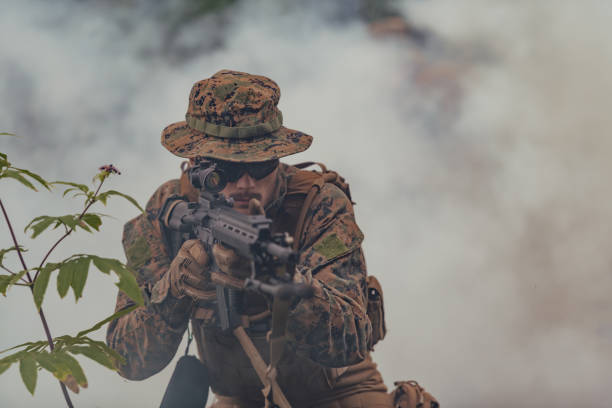 istock A soldier fights in a warforest area surrounded by fire 1477146806