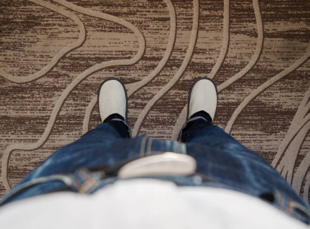istock Men Standing on the Carpet 1477147354