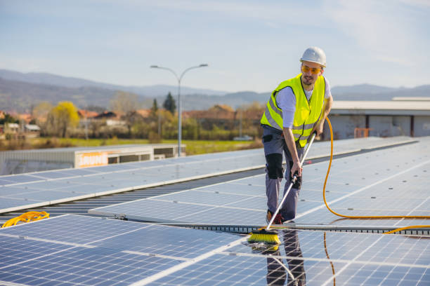 istock Young man cleaning solar panels 1477151940