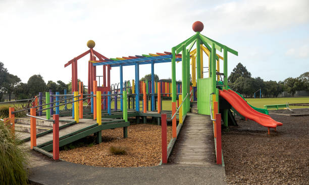 Colorful children's wooden playground structure stock photo