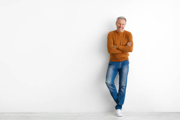 istock Portrait of happy mature man posing at white studio 1477153653