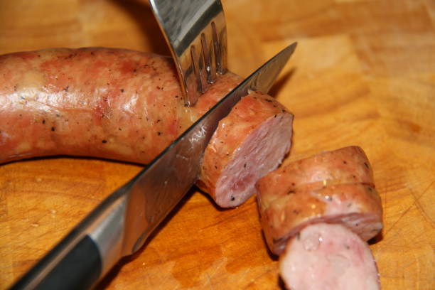 istock Cutting the boiled sausage 1477154863