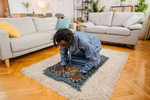 istock Young Black Muslim Man Praying At Home 1477154964