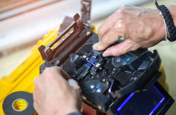 istock Banner template Technician Fiberoptic Fusion Splicing. Worker connecting for Cable Internet signal and Wire connection with Fiber Optic Fusion Splicing machine,fiber optic cable splice machine in work 1477155036