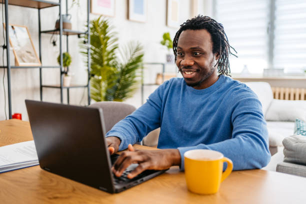 istock Young Man Working On A Laptop At Home 1477155571