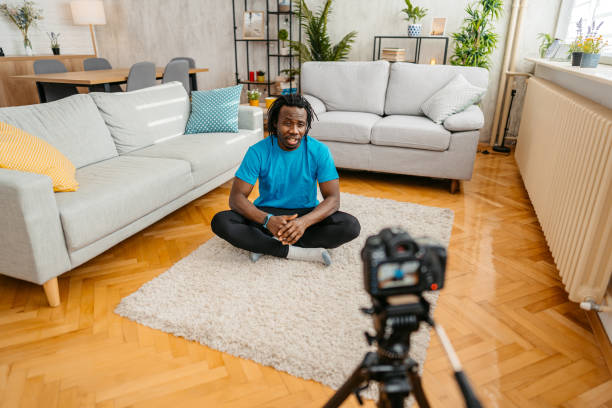 istock Young Man Filming A Vlog On Exercising At Home 1477155701