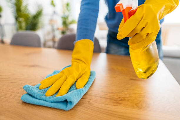 istock Young Man Cleaning His Dining Table At Home 1477159657