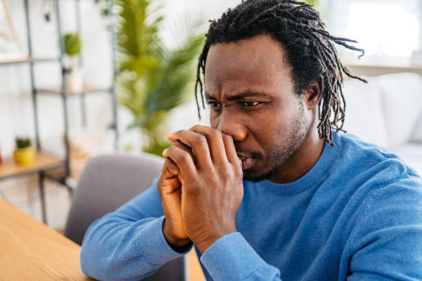 istock Sad Young Man Sitting At Home At The Kitchen Table 1477160873