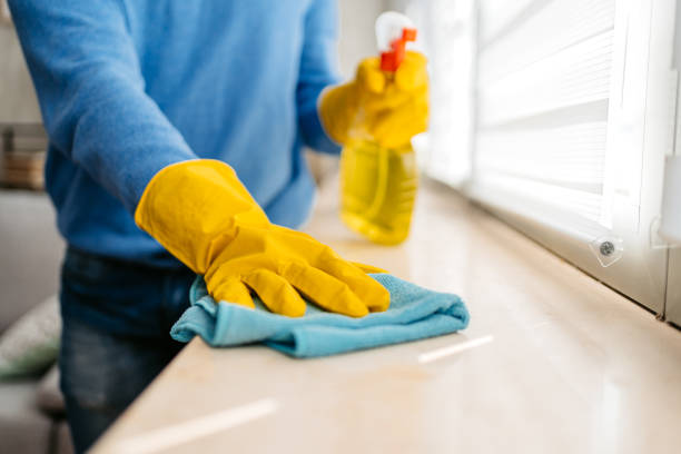 istock Young Man Cleaning His Window Sill At Home 1477161602