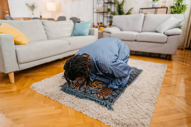 istock Young Black Muslim Man Praying At Home 1477164012