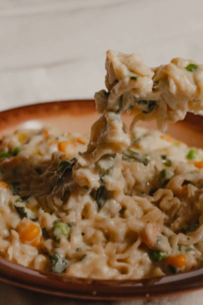 istock pasta in white sauce with vegetables 1477165381