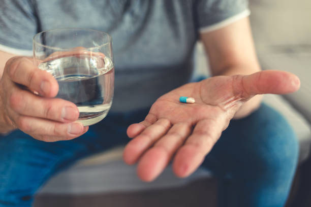 istock Elderly man taking pills for depression. 1477165574