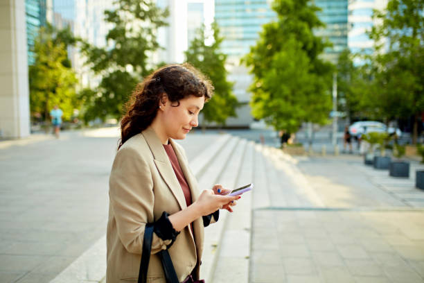 istock Hispanic businesswoman checking smart phone 1477177221