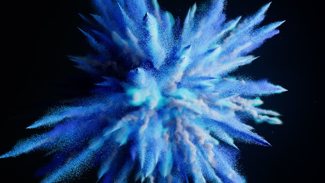 Explosion of bright blue powder on a black background. Bright Snow Burst Paint in Slowmotion.
