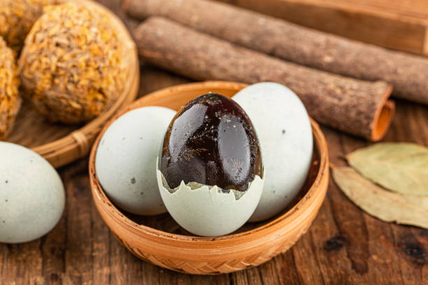 istock preserved duck eggs or Century egg on wood background 1477179212
