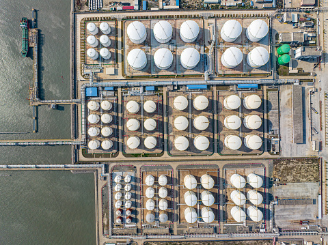 Aerial view of storage tanks for liquefied natural gas by the sea