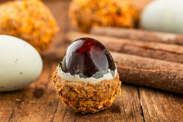 istock preserved duck eggs or Century egg on wood background 1477179512