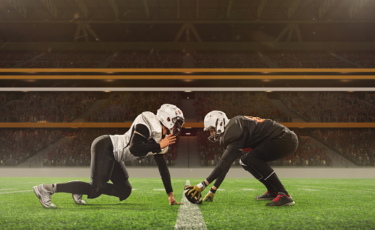 Two american football players in sports uniform and protective equipment in motion, action at 3D model sport stadium arena. Concept of professional competition, struggle, fight, show