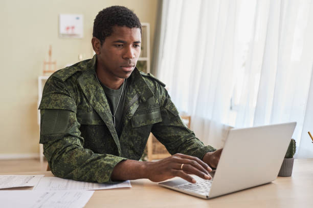 istock Military man working online on laptop 1477181220