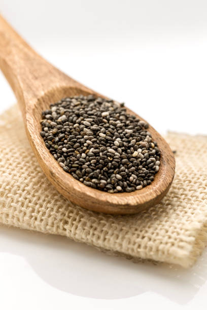 Chia seed in wooden spoon stock photo