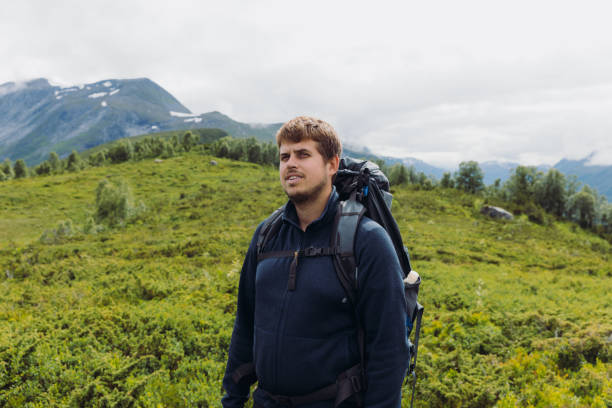 istock A Man with backpack hiking in summer mountains of Norway 1477181380