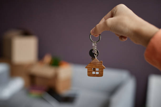 istock Woman getting keys from new apartment 1477182151