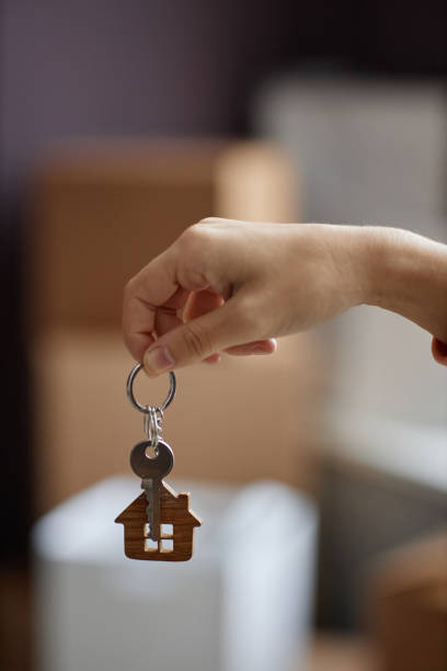 istock Woman holding keys from new apartment 1477182536