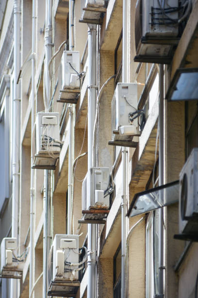 istock Air Conditioners Installed On The Side Of A Building 1477183237