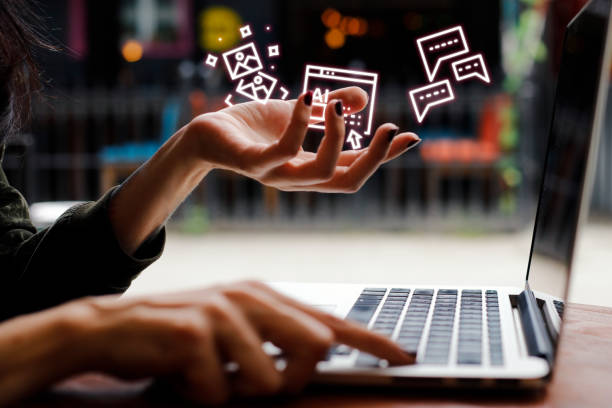 Woman holding ai icons with laptop Woman holding ai icons with laptop advertising stock pictures, royalty-free photos & images